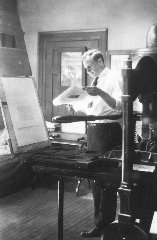 Roycroft artisan Dard Hunter working on a letterpress